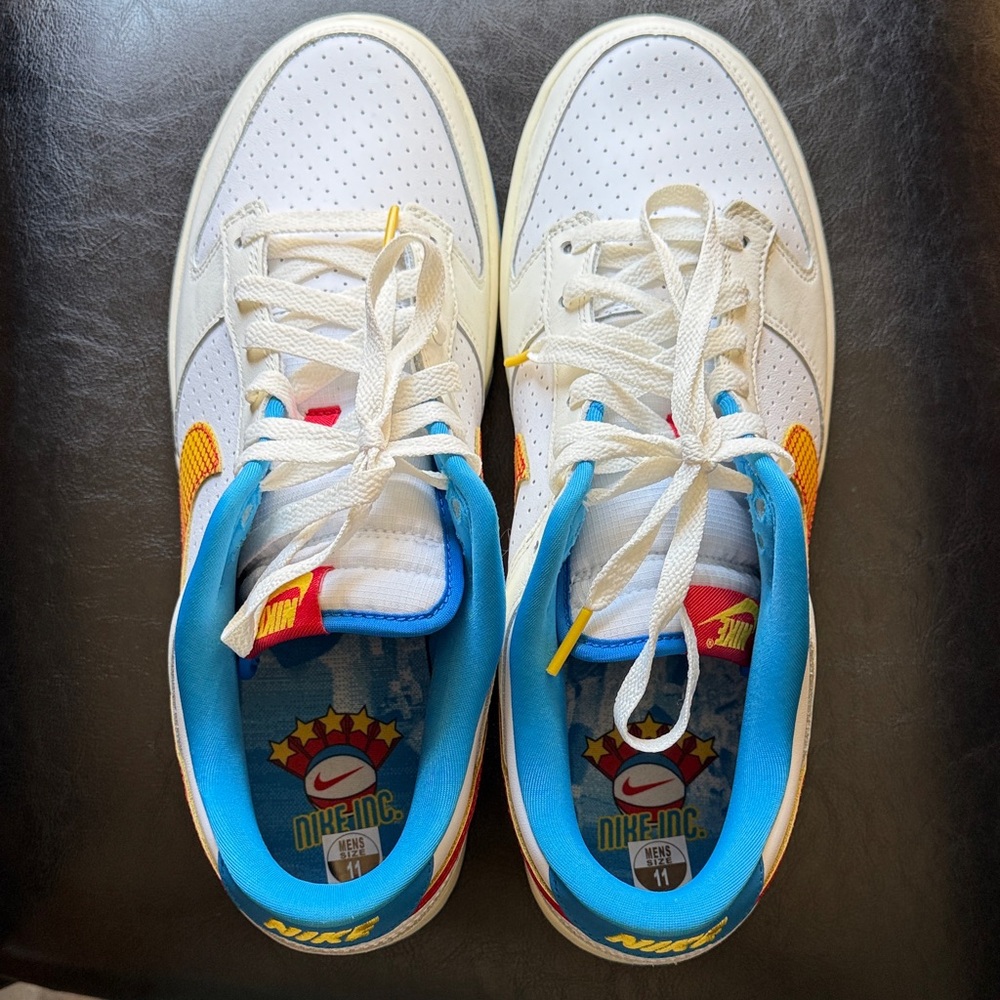 Nike Men’s White Sneakers with Blue and Orange Accents